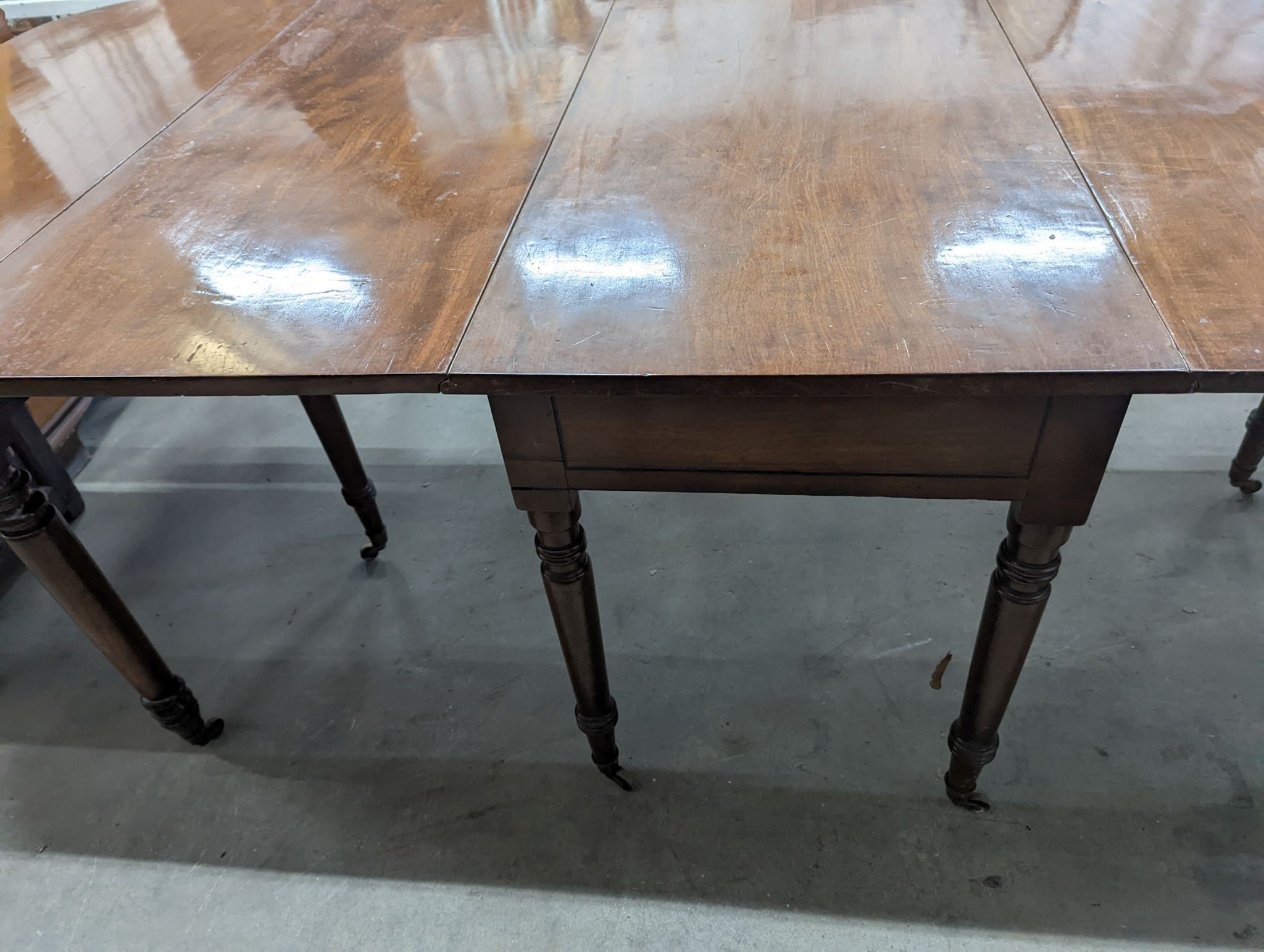 A George IV mahogany D end drop leaf extending dining table, 266cm extended, width 121cm, height 74cm
